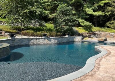 Free form swimming pool, raised beam, dive rock