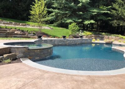 Raised stone spa, fire bowls