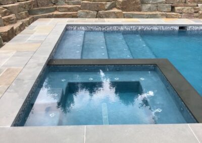 Spa, sheer edge, flush spa, boulder wall