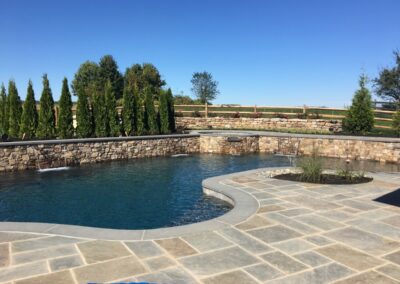 Raised spa, wall and waterfall