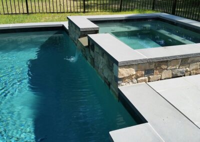 Raised spa with spillover