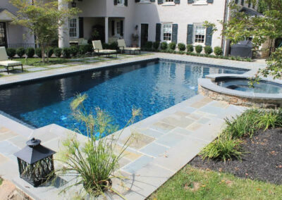 Raised attached spa and rectangle pool