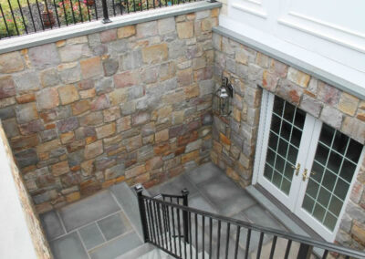 Bluestone deck and stone wall